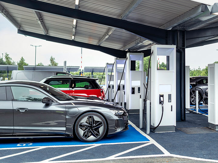 Electric cars parked and charging at an electric charging station in York, UK