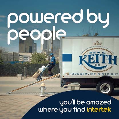 A uniformed employee moving product out of a Ben E Keith delivery truck